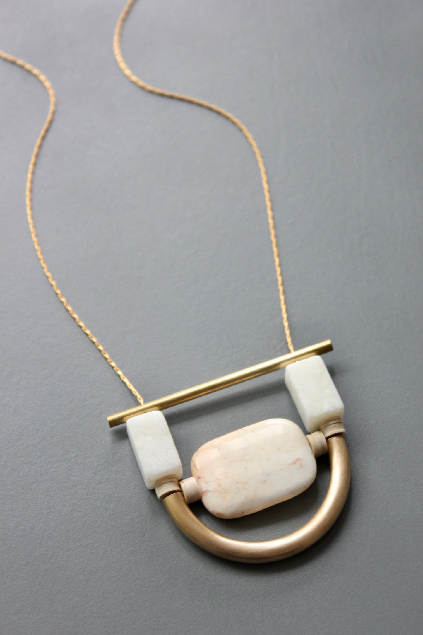 ISL117 White stone and brass geometric necklace