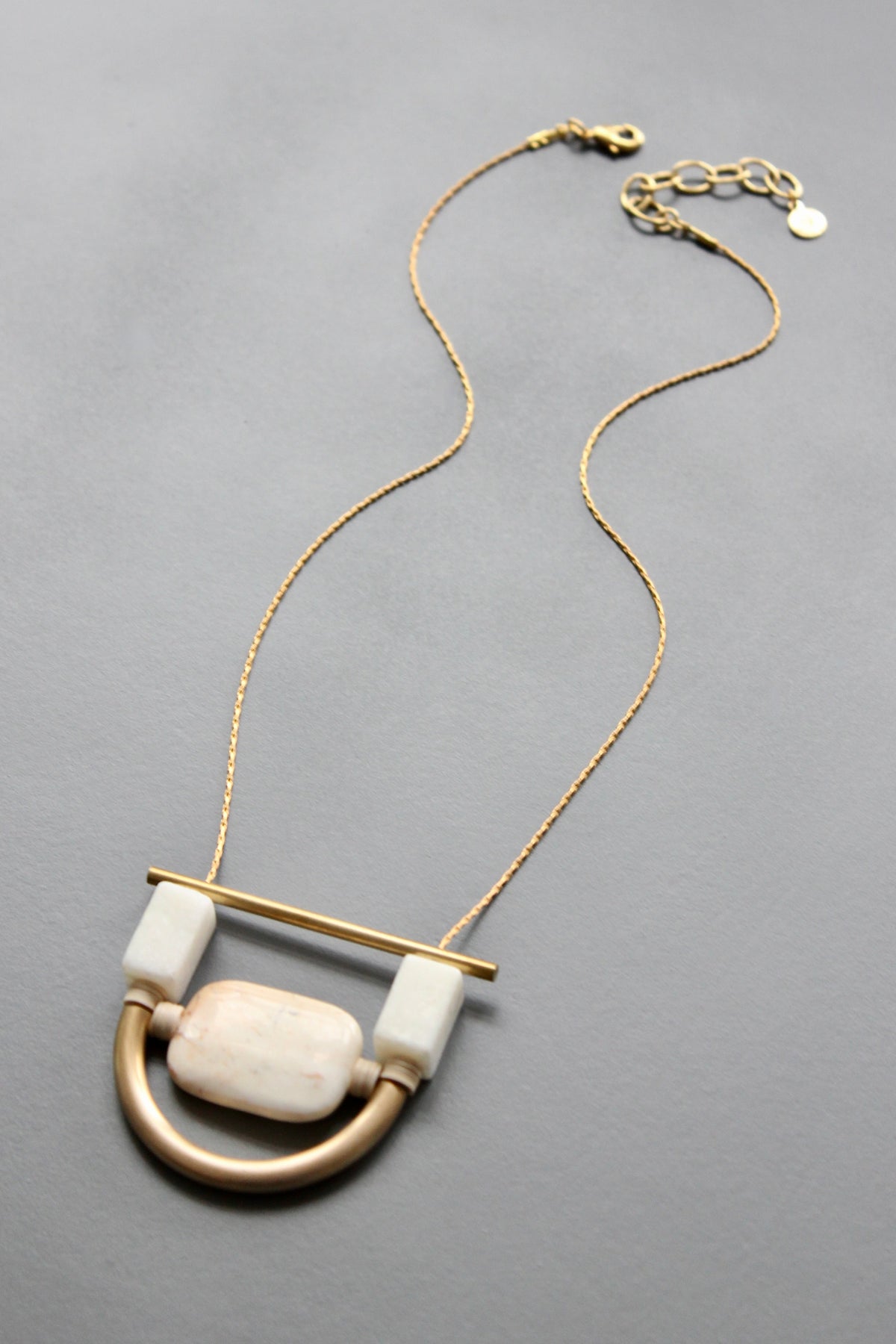 ISL117 White stone and brass geometric necklace