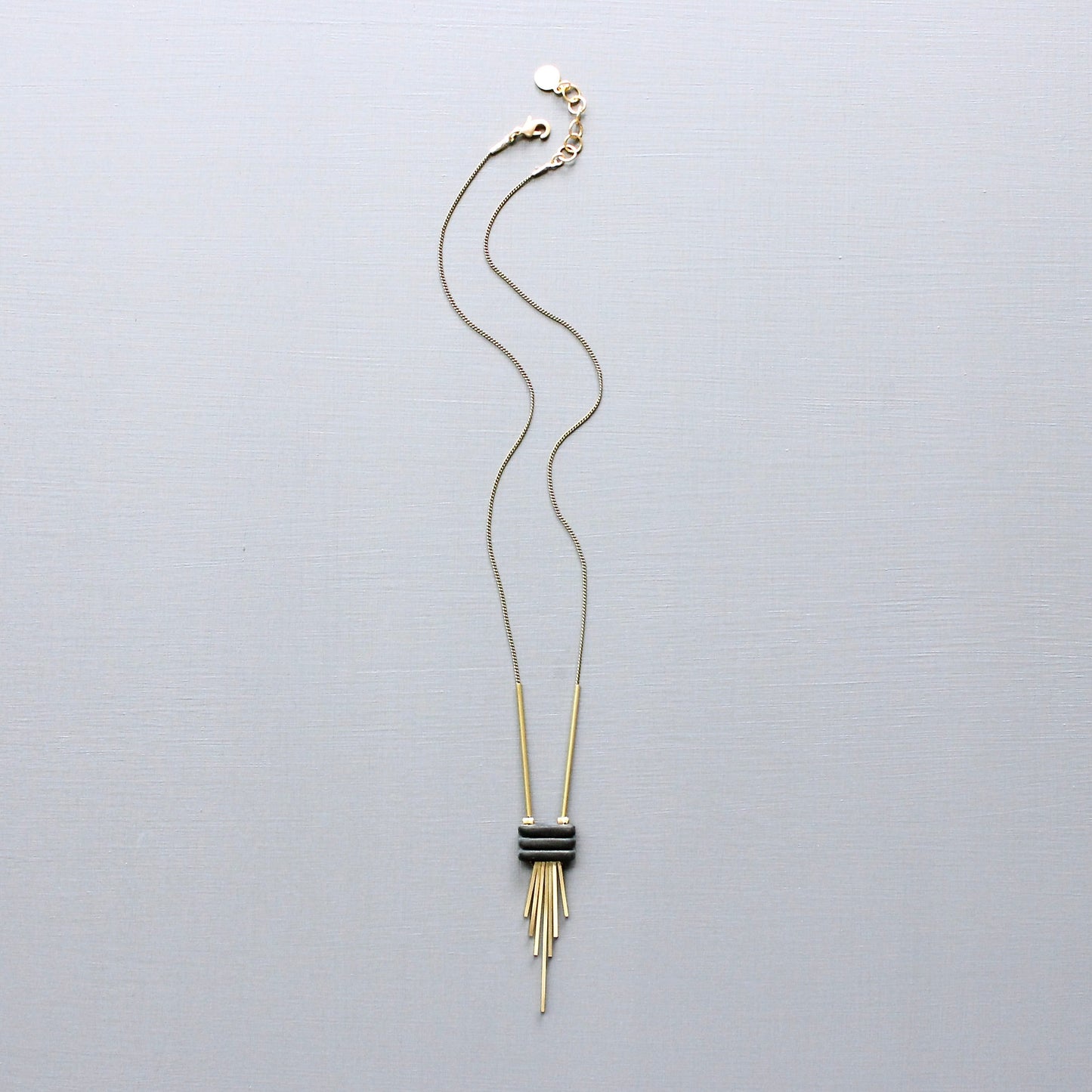 JLT316 black and brass fringe necklace