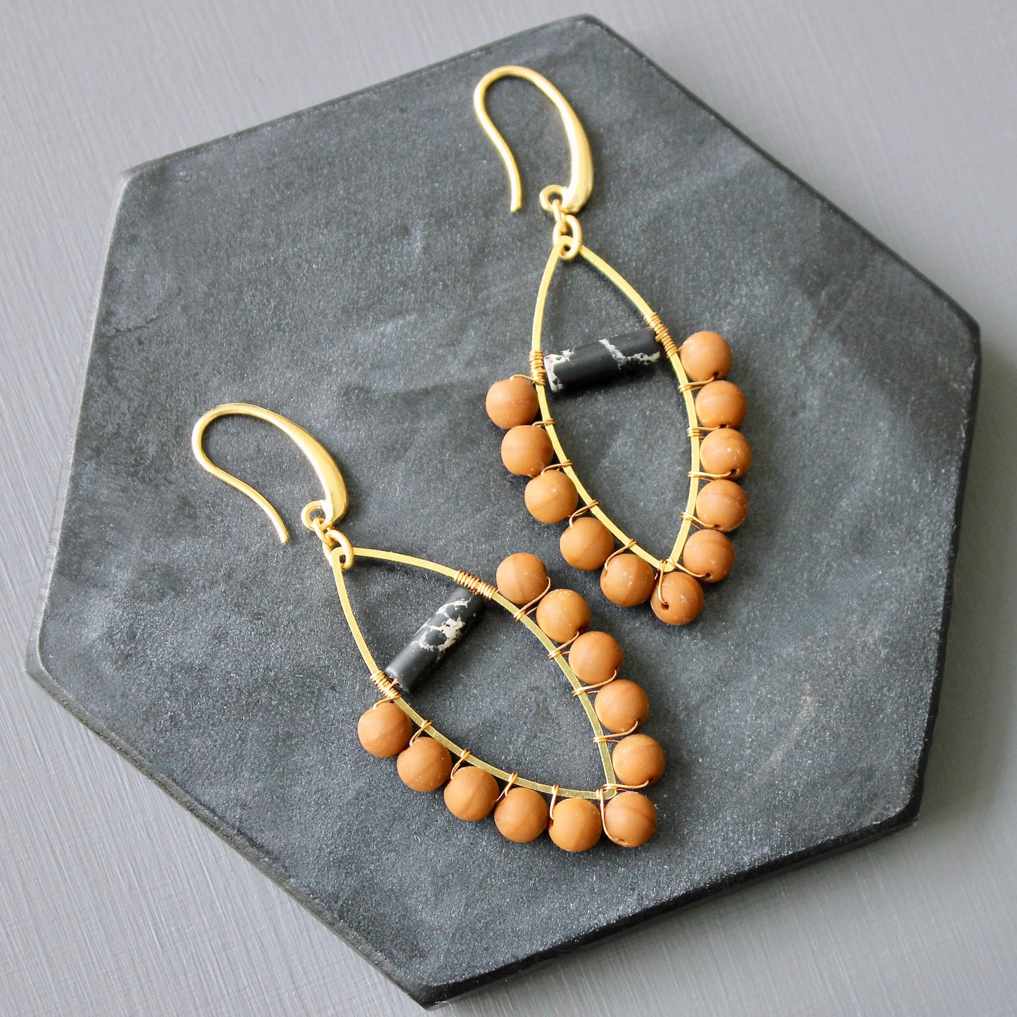 JLTE40 wire wrapped orange and black earrings