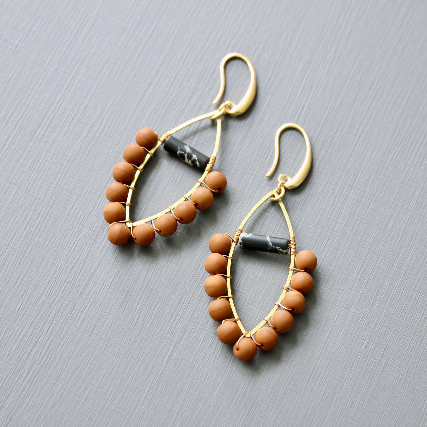 JLTE40 wire wrapped orange and black earrings