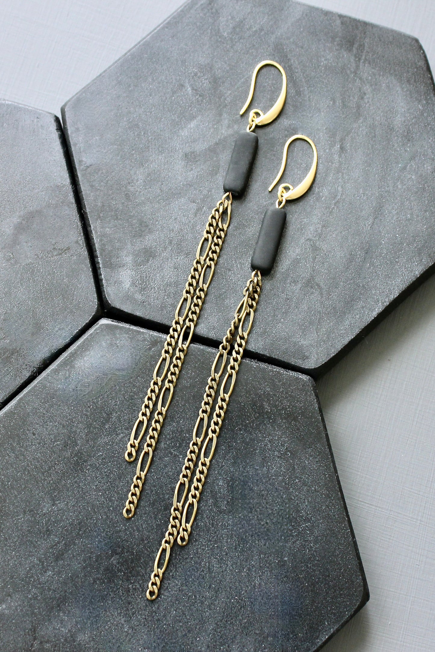 JLTE74 brass and black shoulder duster earrings