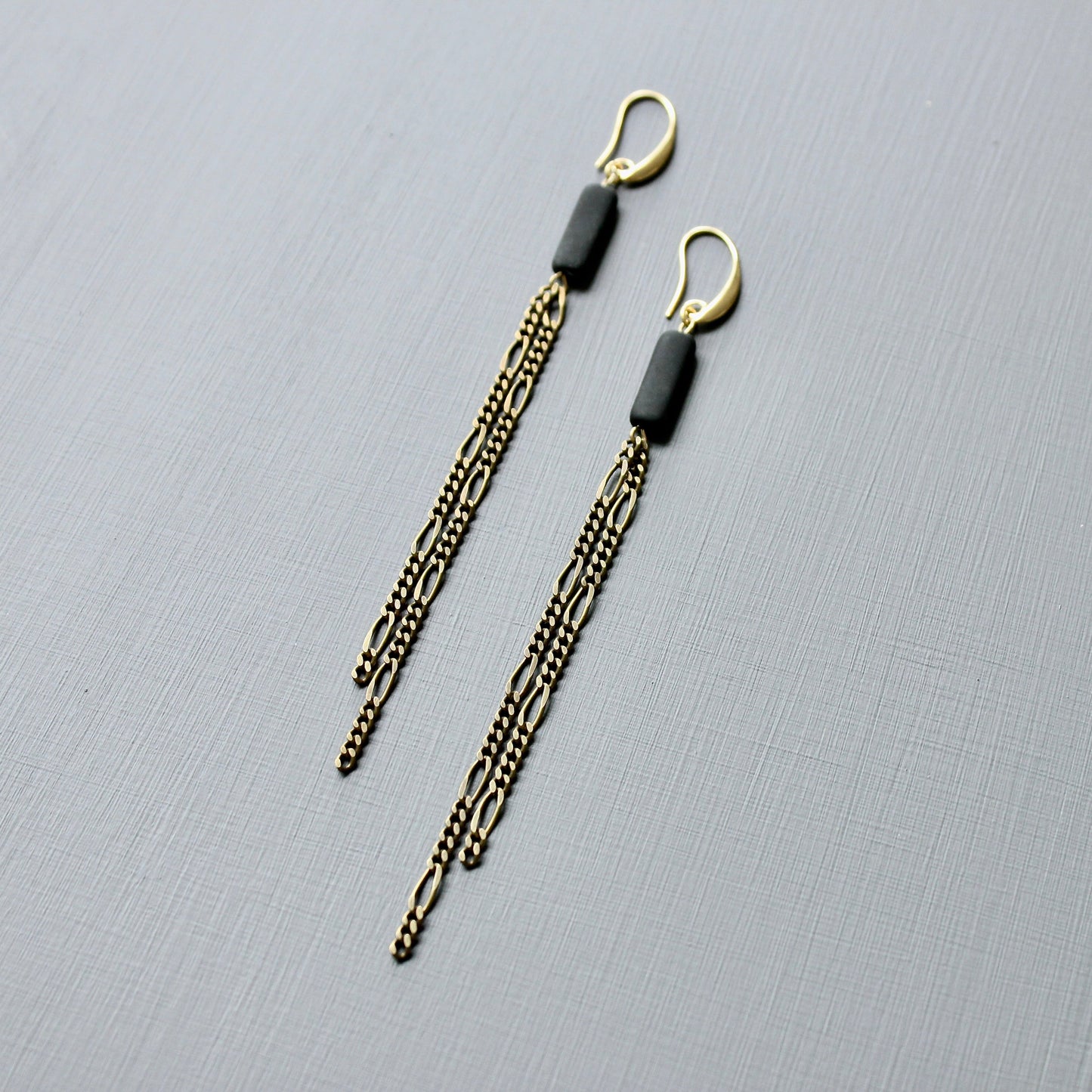 JLTE74 brass and black shoulder duster earrings