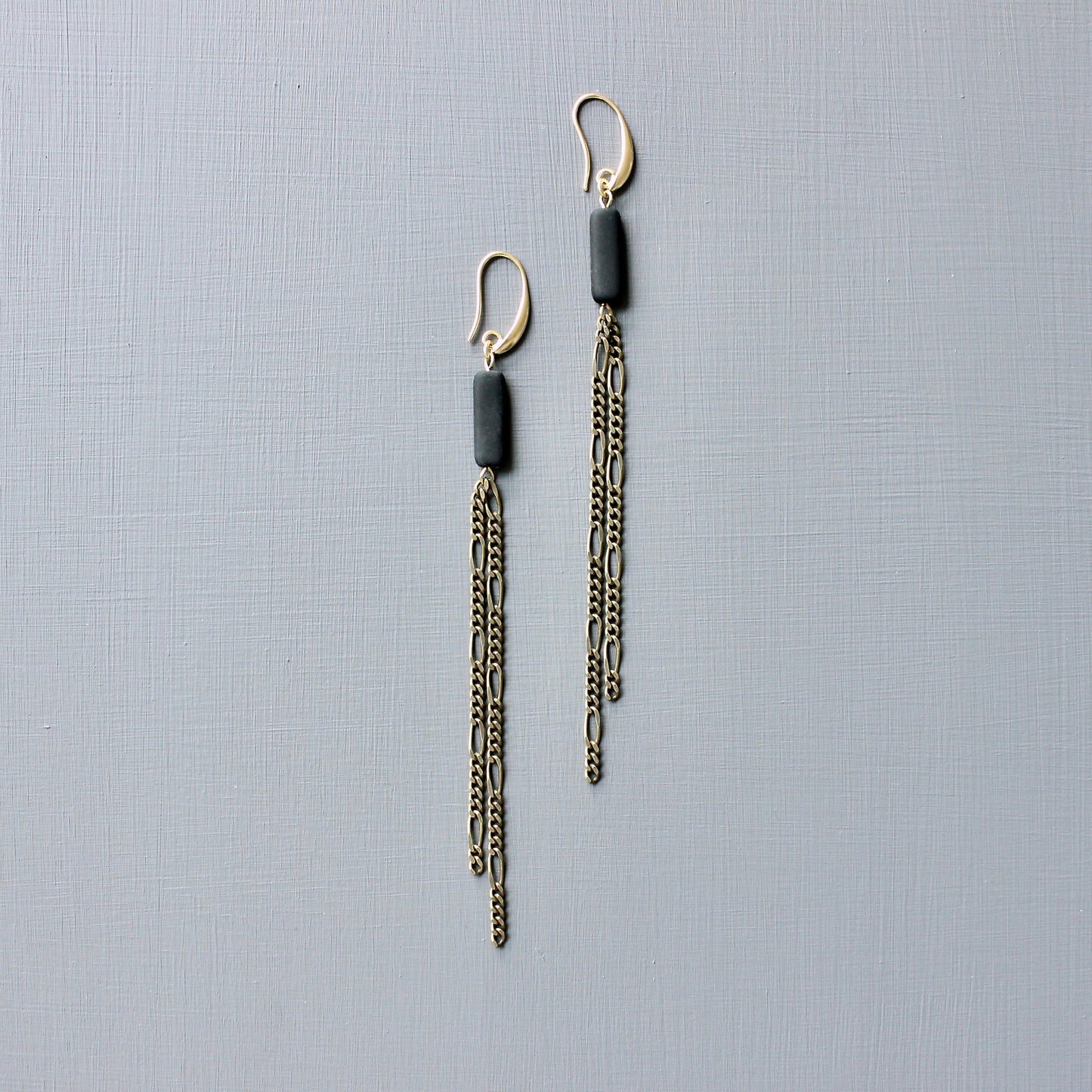JLTE74 brass and black shoulder duster earrings