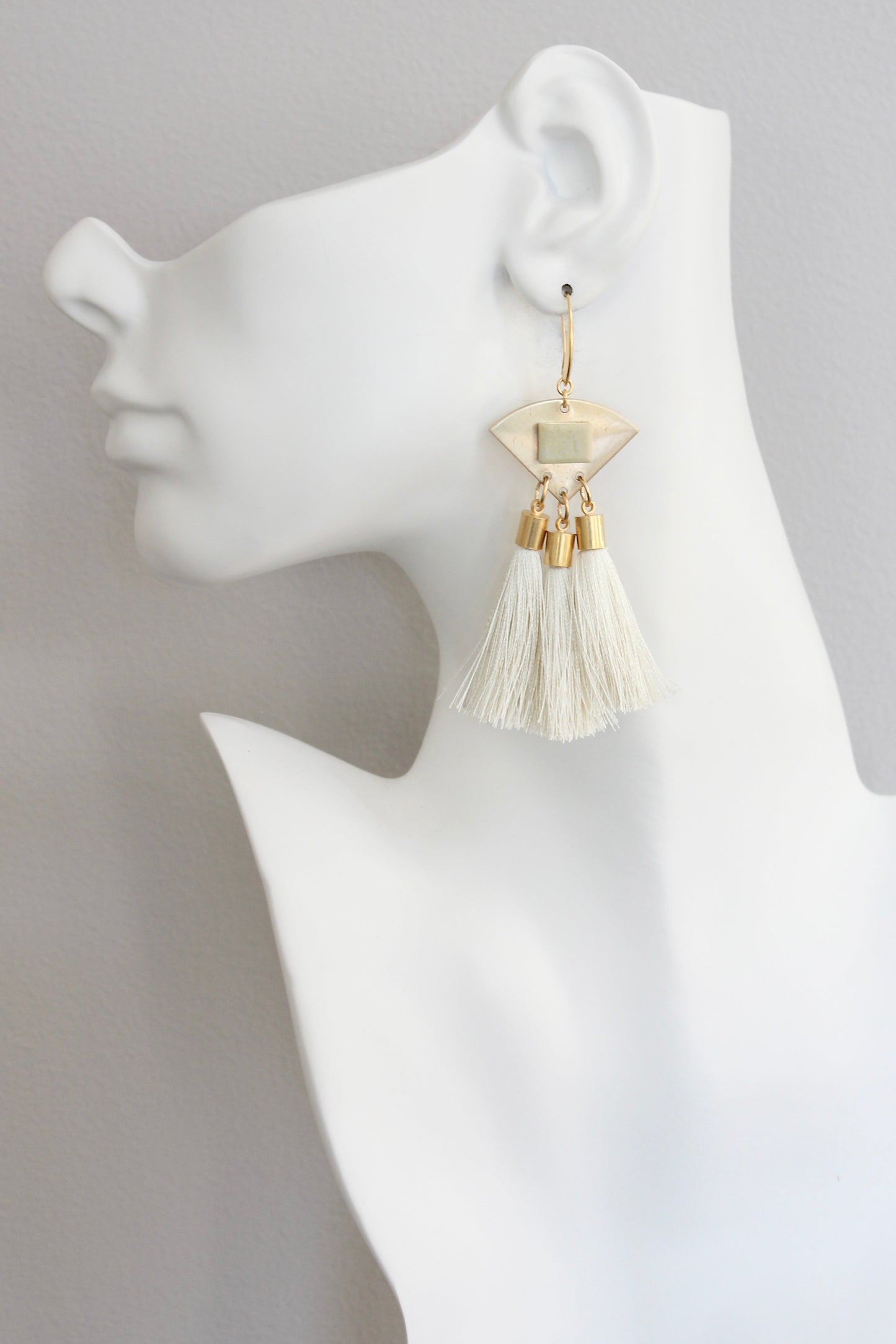 ISLE55 Serpentine and cream tassel geometric earrings