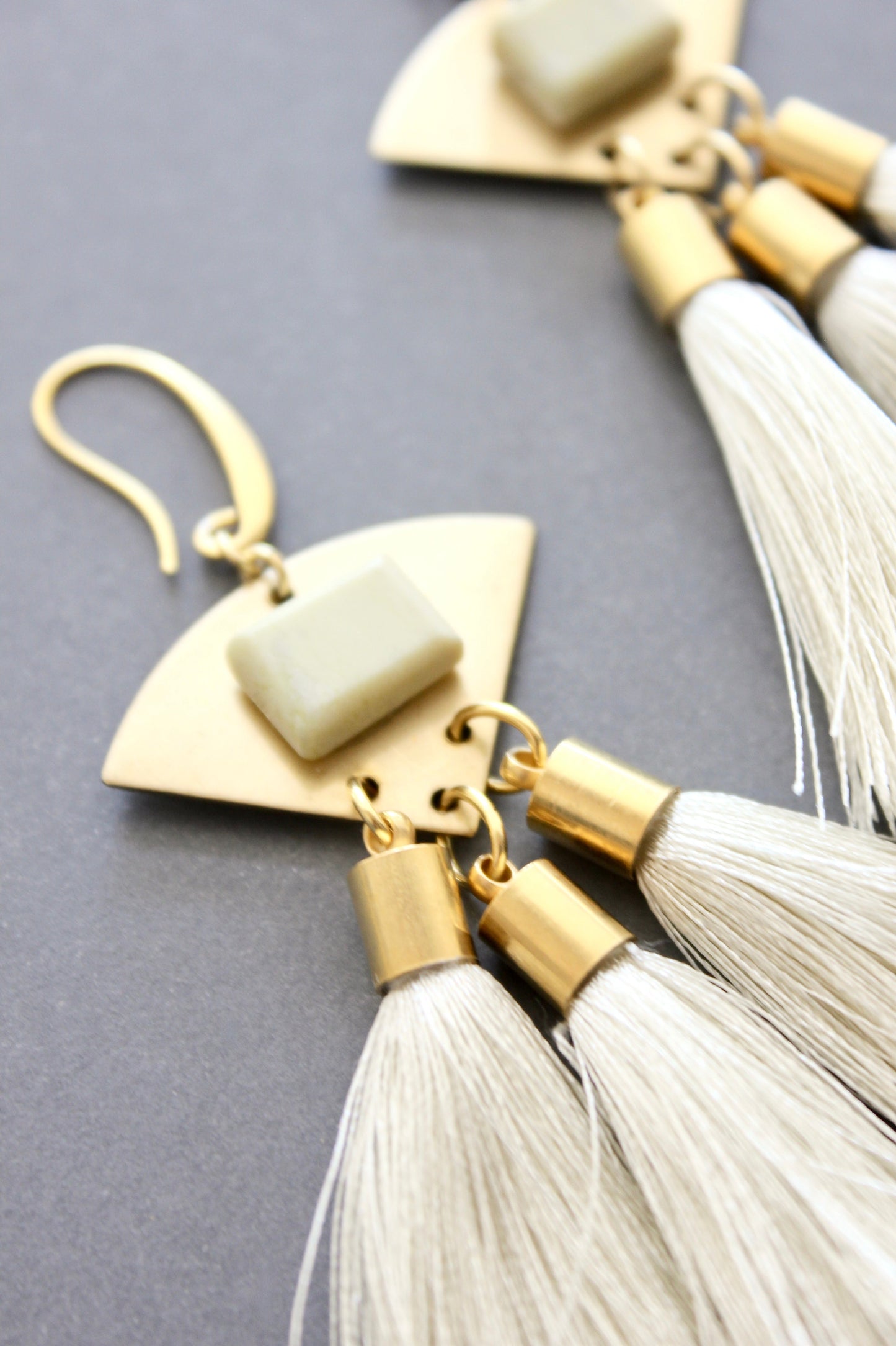 ISLE55 Serpentine and cream tassel geometric earrings