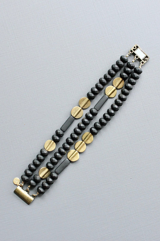 JLTB07 black and brass triple strand bracelet