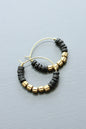 LEXE02 Black lava beads and brass hoop earrings
