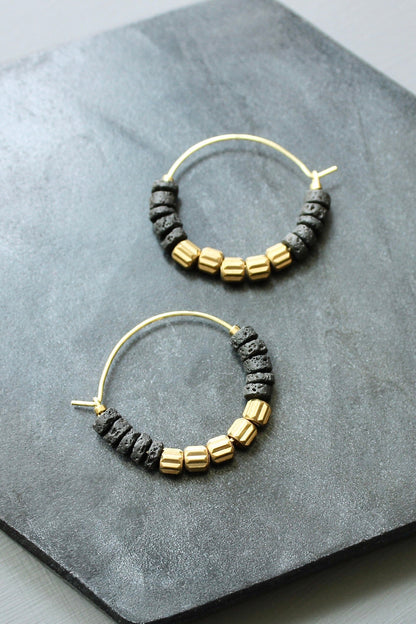 LEXE02 Black lava beads and brass hoop earrings